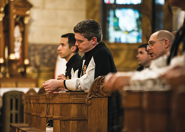 Vision 2026 Pierce 7 About-face to the priesthood Brother Nathaniel Pierce, S.J.C. prays the Rosary with community members.